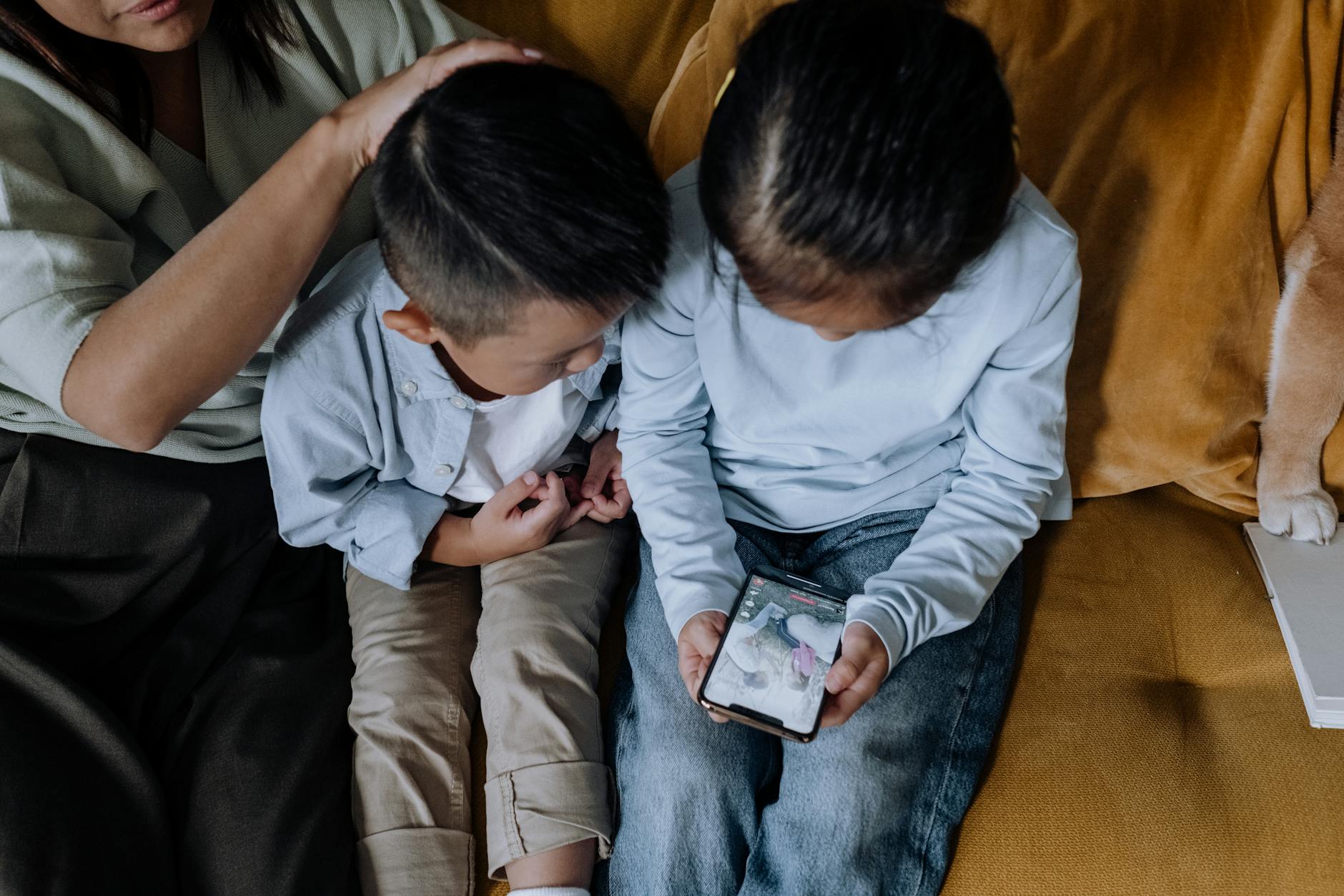 child addicted to phone — photo by cottonbro studio on Pexels