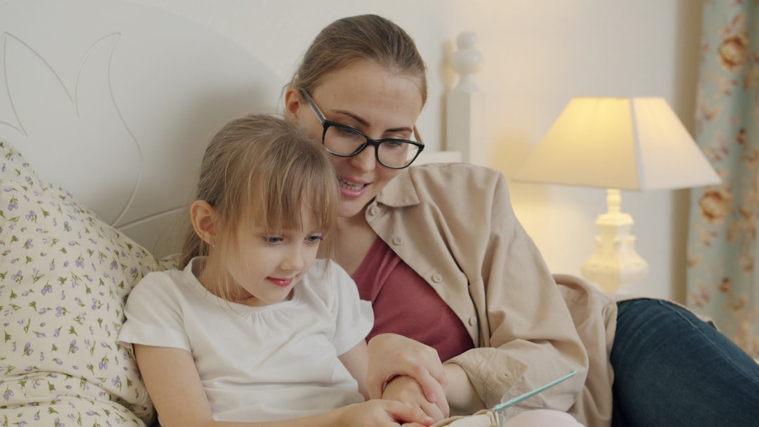 A parent and child spending quiet time reading together at home